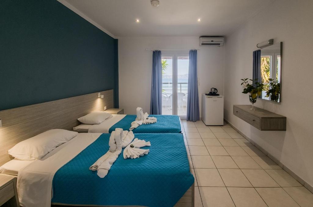 Beachfront Room · Main Block — twin beds, balcony, sea side